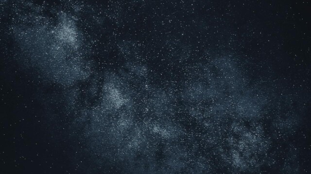 Star-filled night sky over mountains Starry sky with Milky Way over mountains